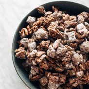 Puppy chow piled in a bowl.