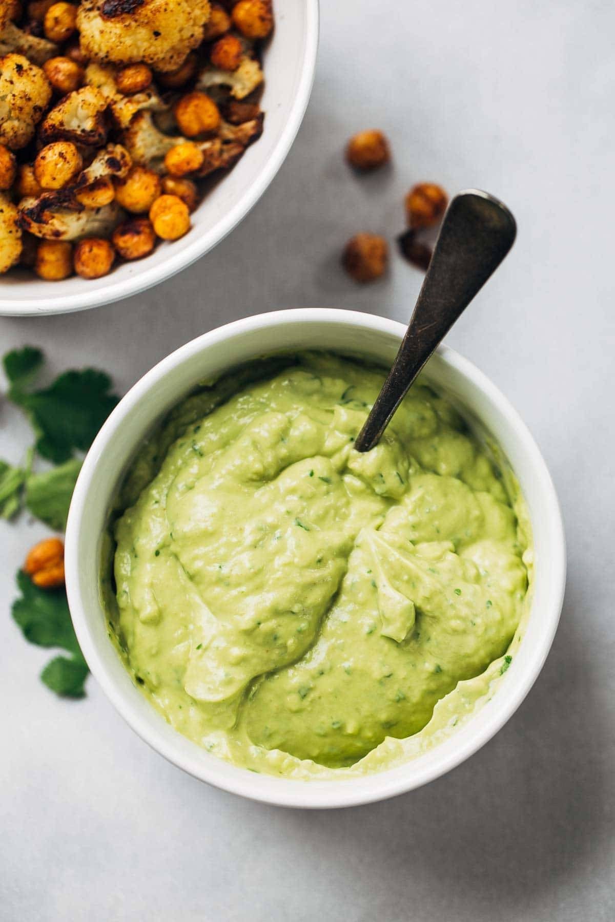 Avocado Dip in a bowl with a spoon.