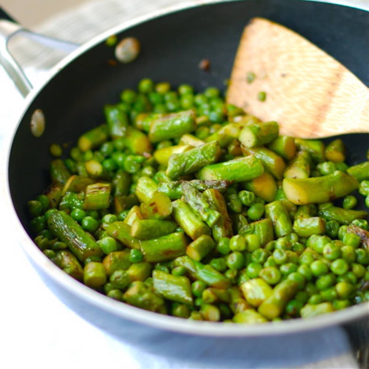 Butter, shallots and honey with asparagus and pea saute.