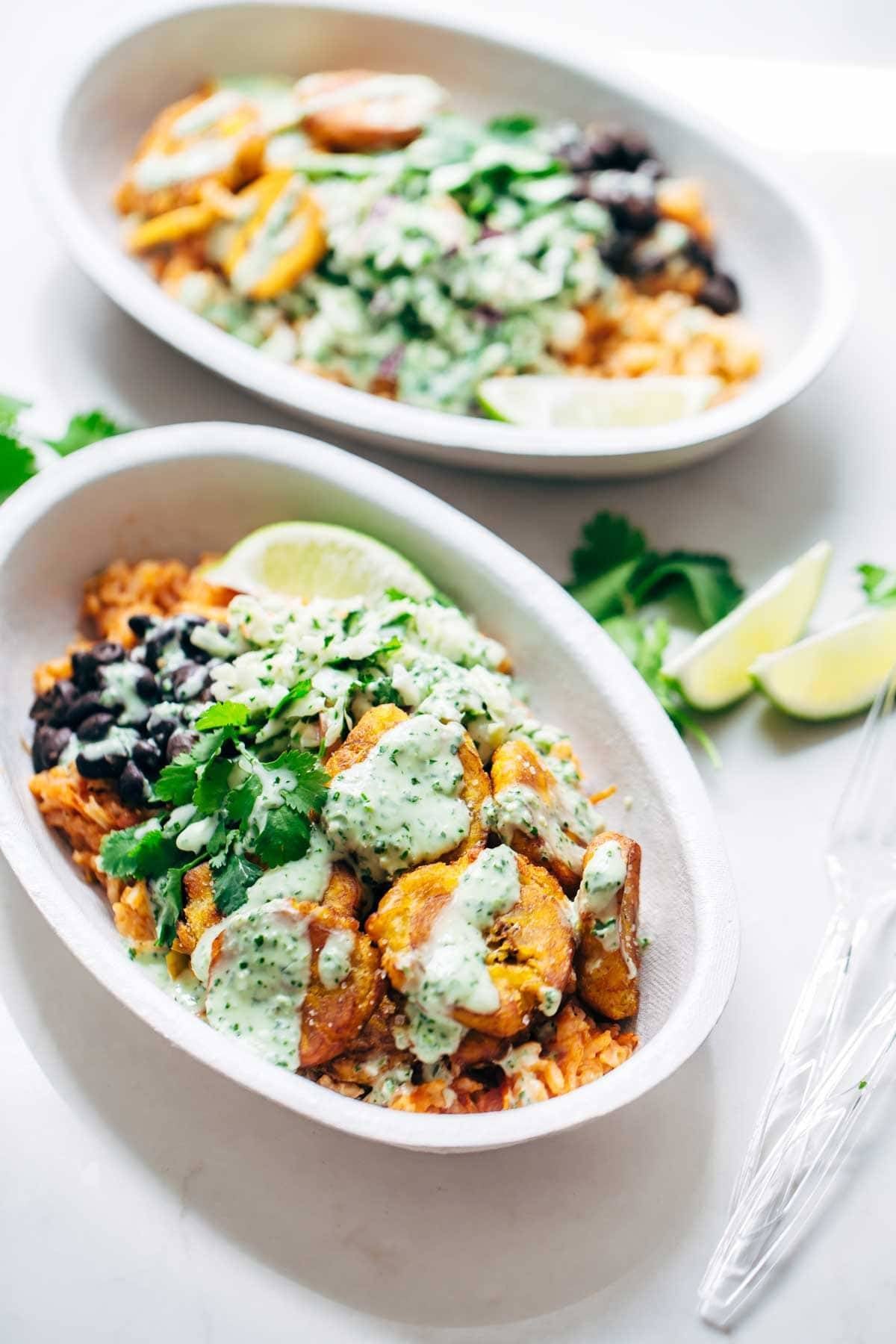 Spicy Brazilian Burrito Bowls recipe featuring seasoned rice and beans, garlic cilantro lime slaw, and crispy fried plantains. So good // almost vegan. | pinchofyum.com Spicy Brazilian Burrito Bowls recipe featuring seasoned rice and beans, garlic cilantro lime slaw, and crispy fried plantains. So good // almost vegan. | pinchofyum.com