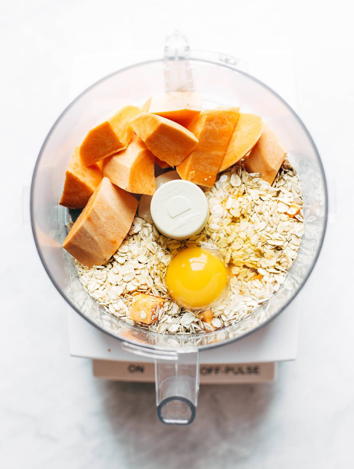 Sweet potato crust ingredients in a food processor.