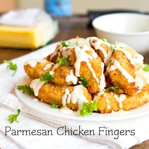 Parmesan chicken fingers dipped in a homemade garlic cheese sauce.